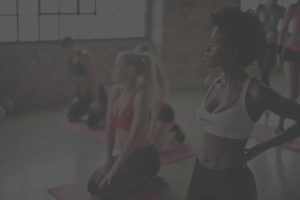 People doing yoga in a yoga studio